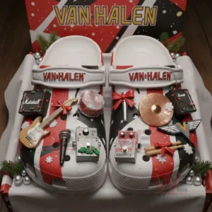 Van Halen themed clogs in a gift box decorated with charms shaped like guitars amplifiers pedals drums cymbals and holiday accents.