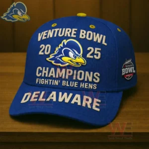 Royal blue Delaware Fightin Blue Hens cap with Venture Bowl two thousand twenty five champions embroidery and Delaware text on the brim displayed on a wooden surface.