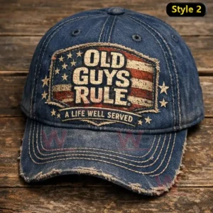 Blue denim cap with a distressed American flag patch reading Old Guys Rule and A Life Well Served plus a frayed worn brim.