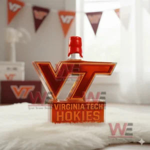 A Virginia Tech emblem bottle displayed on a white fur mat with orange and maroon banners in the background!