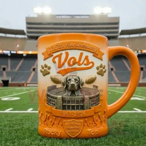 Orange sports themed mug displayed on a football field with a stadium backdrop and raised decorative details!