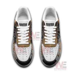 A top view of themed sneakers displaying Warren Zeiders branding and lightning inspired graphics.