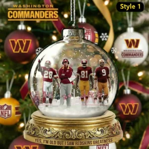 A glass ornament showing four Washington football figures from behind with visible jersey numbers surrounded by snow inside a festive holiday globe!