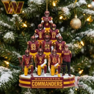 Washington Commanders ornament with players stacked in a tree shape and coach on the base hanging on a Christmas tree!