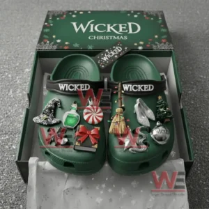 Green Wicked themed clogs with various charms placed inside a Wicked Christmas gift box!
