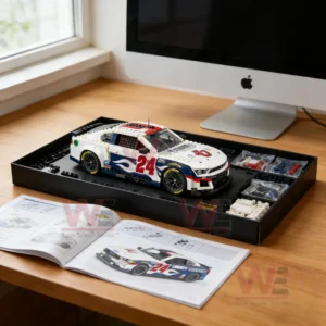 Building block racing car model in assembly tray with instructions and parts on a desk!