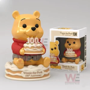 Winnie the Pooh anniversary figure holding a birthday cake and displayed next to its box on a clean studio background!