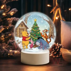 A snow globe showing Pooh Piglet Tigger and Eeyore decorating a Christmas tree near a snowy cabin!