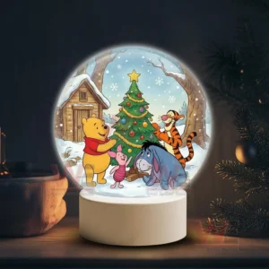 Winnie the Pooh Christmas Snowball Decoration Led Light 5 A snow globe showing Pooh Piglet Tigger and Eeyore around a decorated Christmas tree in a snowy forest!