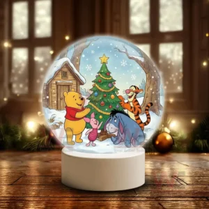 Winnie the Pooh Christmas Snowball Decoration Led Light 6 A snow globe showing Pooh Piglet Tigger and Eeyore decorating a Christmas tree beside a snowy cabin!