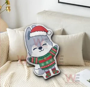 Wolf christmas pillow with santa hat and sweater displayed on a sofa in a warm living room!