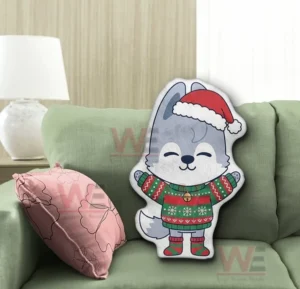 Wolf christmas pillow on a green sofa in a comfortable home setting!