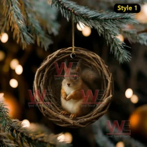 Squirrel ornament sitting inside a round woven nest hanging on a Christmas tree!