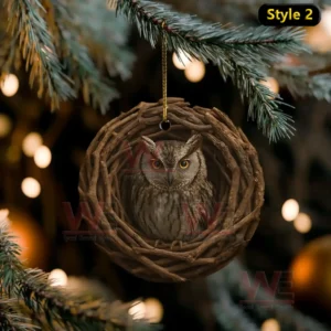 Owl ornament inside a round woven wooden nest hanging on a tree!