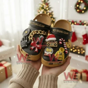 Wu Tang Clan Christmas Crocs Clogs with Charms 6 Hands holding Wu Tang Clan clogs decorated with charms in a festive holiday room!