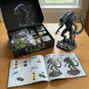Brick alien creature model shown with an open box parts and an instruction book on a wooden table!