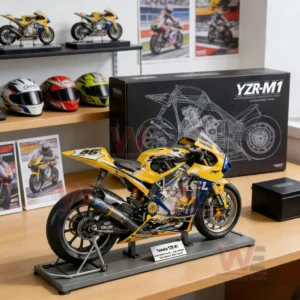 A realistic yellow and blue racing motorcycle model on a display stand in a workshop style room with racing helmets and posters!