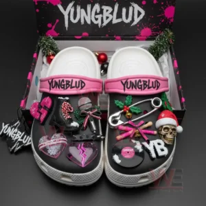 Yungblud themed clogs in a gift box decorated with charms shaped like hearts microphones boots holly safety pins skulls and vinyl records.