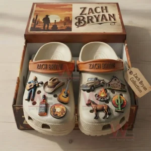 Beige Zach Bryan themed clogs arranged in a display box with music and countryside inspired charms!