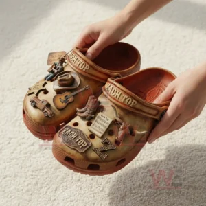 Pair of country style clogs held up to display western themed charms and detailed design!