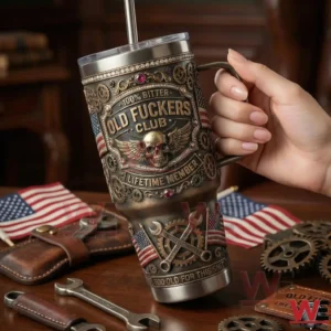 A close view of a hand holding a decorated metal tumbler with skull and mechanical themed artwork!