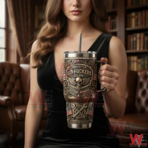 A woman holding a decorated metal tumbler with vintage skull and mechanical details in a library room!