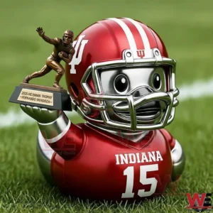 Indiana football player rubber duck wearing a red helmet and jersey number fifteen holding a small trophy while sitting on green grass!