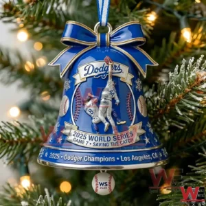 Blue Dodgers bell ornament hanging on a Christmas tree with holiday lights and snowy greenery!