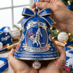 Hands holding a blue Dodgers bell ornament with gold bow and World Series artwork on the front!
