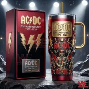 ACDC themed metal tumbler with gold handle and straw placed beside a matching red and black presentation box on a stone surface with spotlight background!