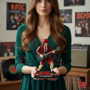 AC/DC 53rd Anniversary Building Brick Figure 3 Woman holding an AC DC inspired brick guitarist figure with music posters behind!