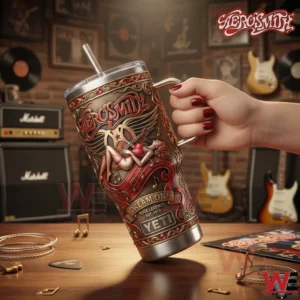 Aerosmith Band Dream On Rock Legends 1970 Yeti 40oz Tumbler 4 A person holding a Yeti tumbler featuring ornate Aerosmith Dream On artwork inside a room filled with guitars and music equipment!