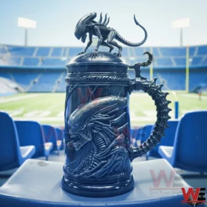 Alien themed beer stein with a xenomorph sculpture on top and intricate creature relief standing on a stadium seat with a football field in the background.