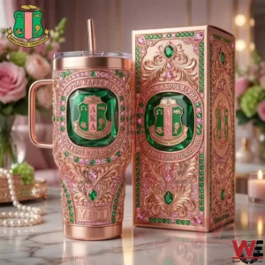 Rose gold Alpha Kappa Alpha tumbler with jeweled detailing and matching gift box arranged on a decorative surface!