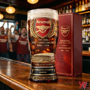 Arsenal 140th anniversary beer glass displayed on a bar counter with branded gift box and pub background!