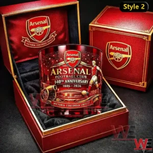 Arsenal 140th Anniversary whiskey glass 7 An Arsenal anniversary whiskey glass with vivid red artwork and football imagery positioned inside an open red wooden presentation box with matching branded lid nearby!