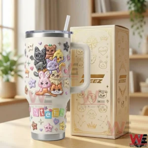 Ateez themed animal tumbler with handle displayed next to a matching gift box on a wooden table!