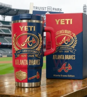 Red and navy insulated tumbler with handle and straw featuring Atlanta Braves anniversary graphics next to a matching collector box on a wooden table with a baseball stadium in the background!