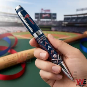 Hand holding an Atlanta Braves anniversary pen at a baseball stadium with field and stands in the background!