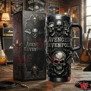 Insulated skull themed tumbler with matching box shown on a table in a music studio environment with guitars and posters!