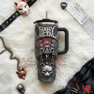 A flat lay view of a Yeti tumbler showcasing BABYMETAL kawaii metal artwork styled with music accessories and decorative objects!