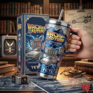 A hand holding a Back To The Future insulated tumbler above a desk with blueprints tools and retro devices!