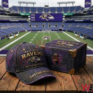 Baltimore Ravens 30th Anniversary Casual Cap hat 3 A Baltimore Ravens anniversary cap and matching keepsake box displayed on a wooden table with a football stadium and field in the background!