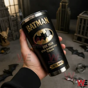 Batman Gotham City The Dark Knight Tumbler 3 A close view of a Batman themed tumbler held in a hand with a dark Gotham City background gold bat emblem and cinematic lighting!