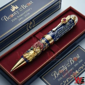 Beauty and the Beast anniversary ballpoint pen resting inside a decorative presentation box with gold accents!