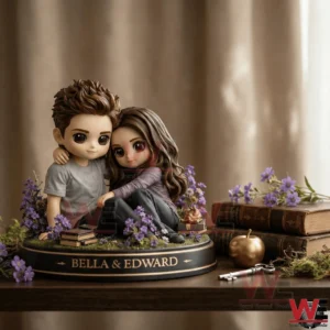 Stylized couple figurine sitting together on a decorative base with flowers books and soft lighting!
