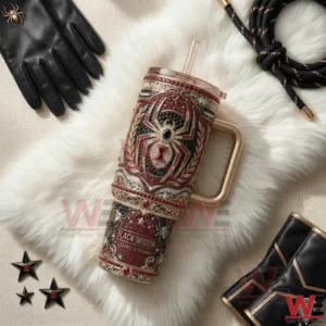 A decorative Black Widow themed tumbler with jeweled spider design placed on white fur alongside black gloves stars and luxury accessories!