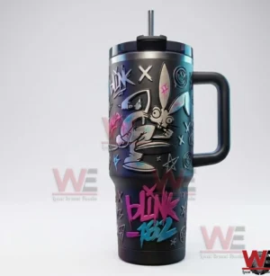 Front view of a Blink 182 themed insulated tumbler with handle straw graffiti artwork and bunny illustration on a white background.