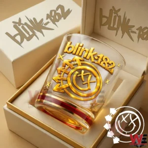 Blink 182 The Rock Show Gold Glass 10 A gold detailed blink 182 whiskey glass placed inside an elegant gift box photographed at an angle!