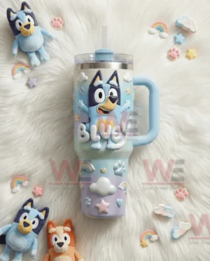 Bluey tumbler with handle and straw displayed on white fur with small plush toys and pastel decorations!